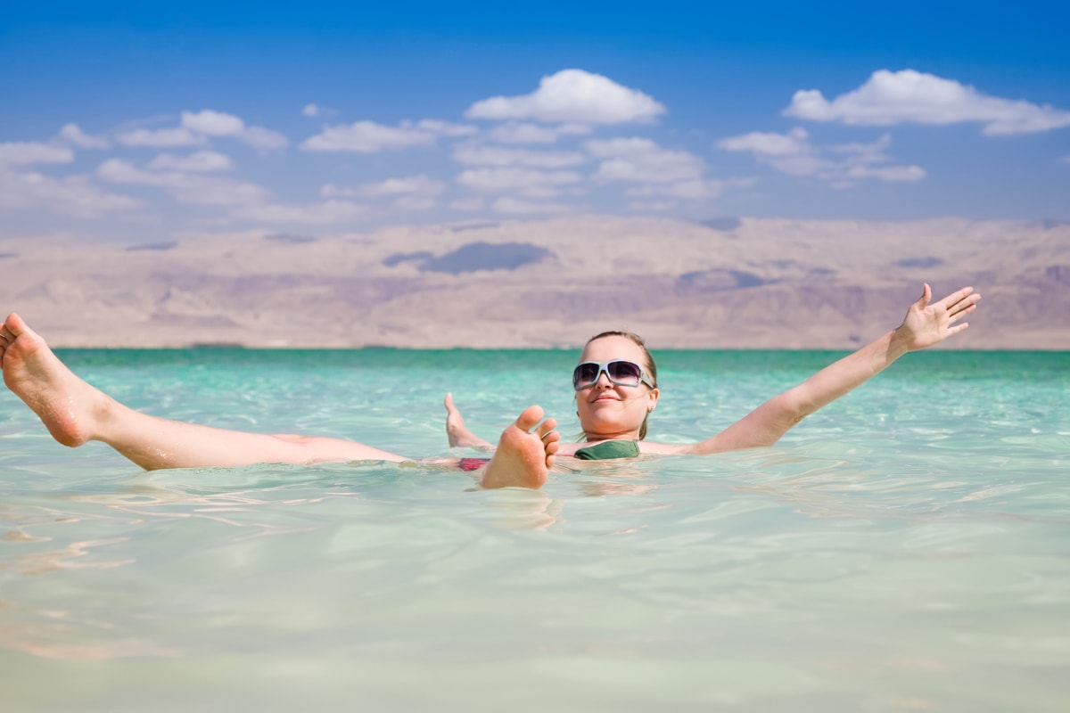 woman floating in the dead sea