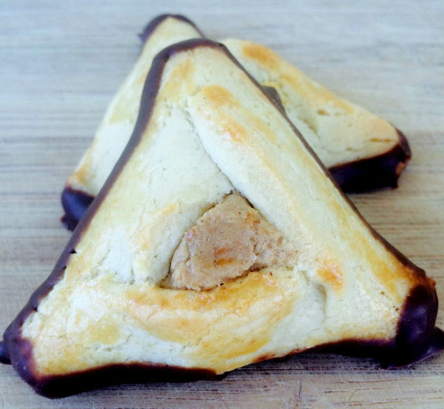 hamantaschen with caramel filling and chocolate on the outside